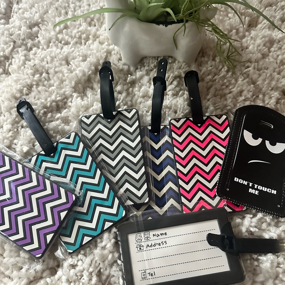 Cute set of brand new luggage tags in various patterns & colors.Travel a…